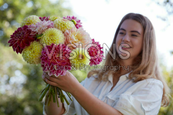 Lady holding bunch of dahlias Lady holding bunch of dahlias
