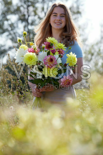 Lady holding bunch of dahlias Lady holding bunch of dahlias