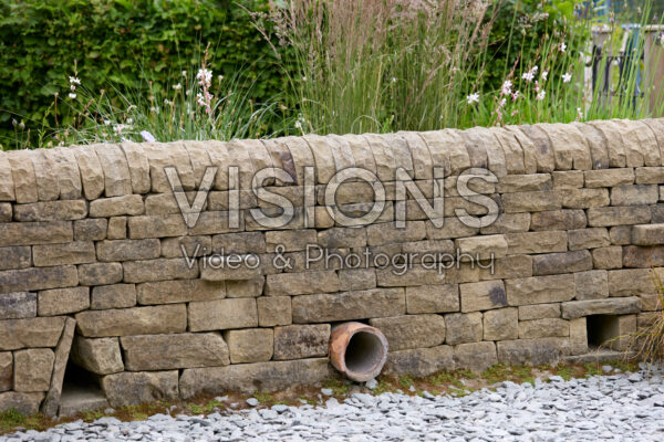 Stone wall with hedgehog holes, hedgehog highway