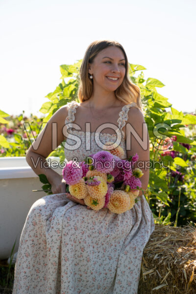 Lady holding bunch of dahlias