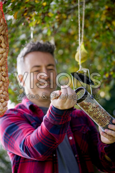 Filling bird feeder Filling bird feeder