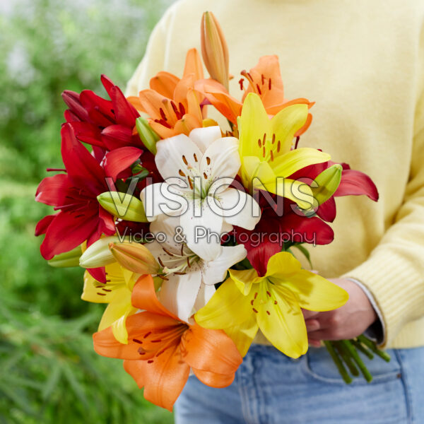 Lady holding bunch of lilies