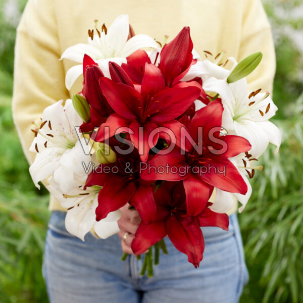 Lady holding bunch of lilies