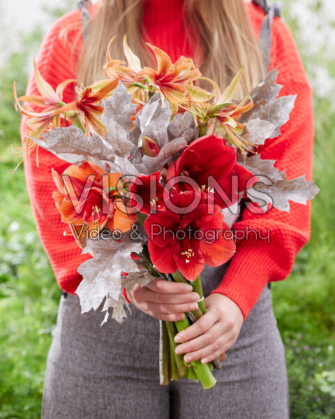 Lady holding amaryllis bouquet