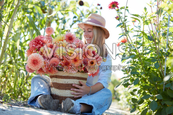 Lady with basket of mixed dahlias Lady with basket of mixed dahlias