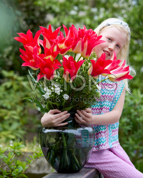 Girl with vase of Love Story tulips Girl with vase of Love Story tulips