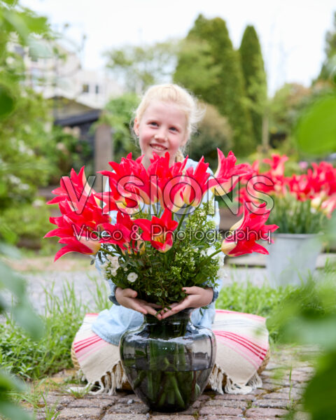 Girl with vase of Love Story tulips Girl with vase of Love Story tulips