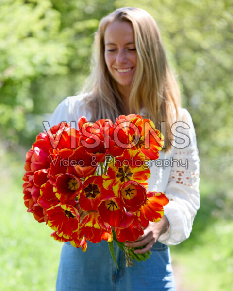 Lady with mixed tulip bouquet Lady with mixed tulip bouquet