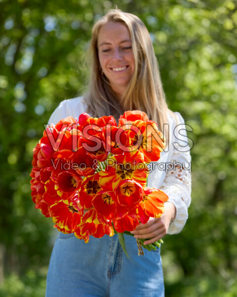 Lady with mixed tulip bouquet