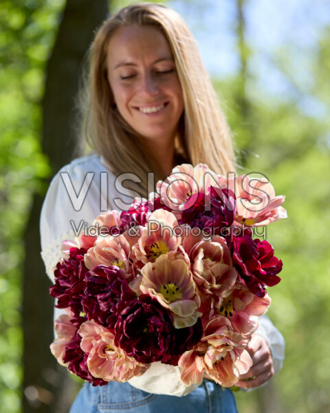 Lady with double flowered tulip bouquet Lady with double flowered tulip bouquet