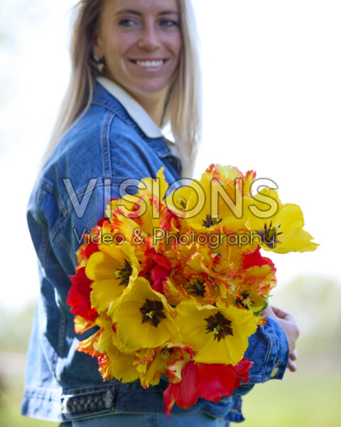 Lady with mixed tulip bouquet red and yellow
