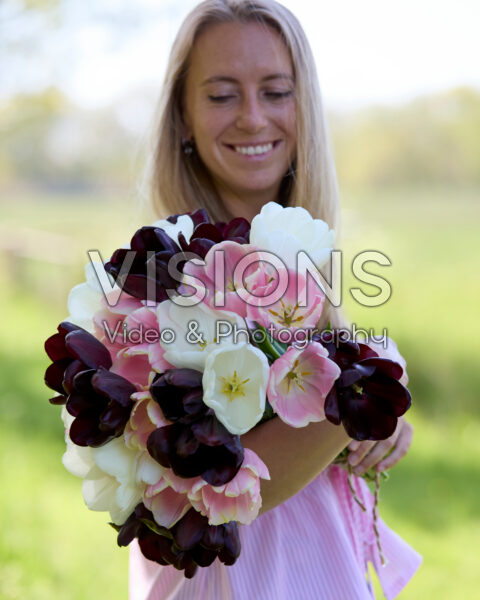 Lady with mixed tulip bouquet