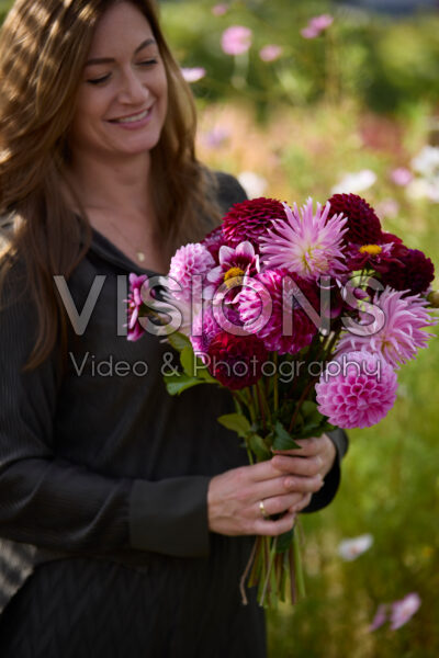 Lady with mixed dahlia bouquet Lady with mixed dahlia bouquet