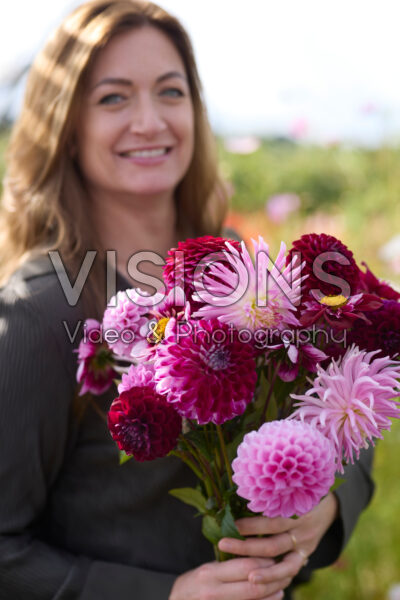 Lady with mixed dahlia bouquet Lady with mixed dahlia bouquet