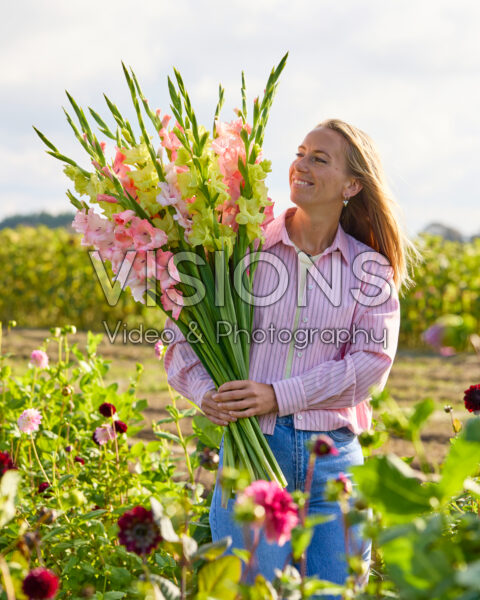 Lady with mixed gladioli bouquet Lady with mixed gladioli bouquet