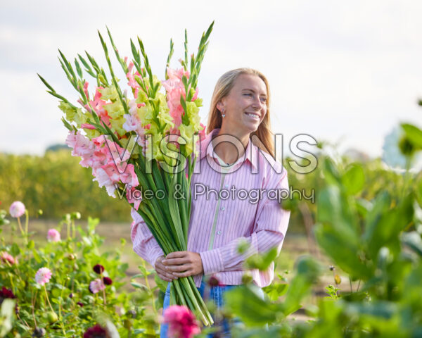 Lady with mixed gladioli bouquet Lady with mixed gladioli bouquet