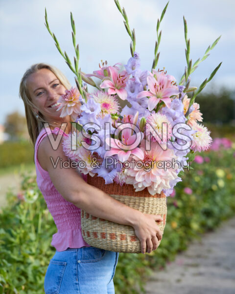 Lady with mixed summer flowers