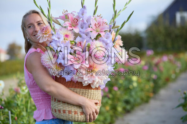Lady with mixed summer flowers Lady with mixed summer flowers