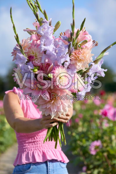 Lady with mixed summer flowers Lady with mixed summer flowers