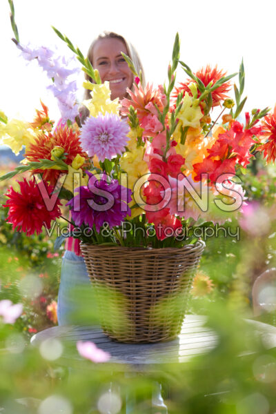 Lady with mixed summer flowers Lady with mixed summer flowers