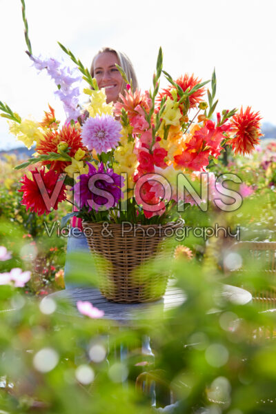 Lady with mixed summer flowers Lady with mixed summer flowers