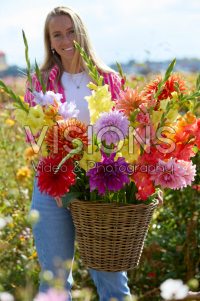 Lady with mixed summer flowers Lady with mixed summer flowers