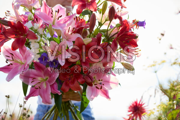 Lady with mixed summer flowers Lady with mixed summer flowers