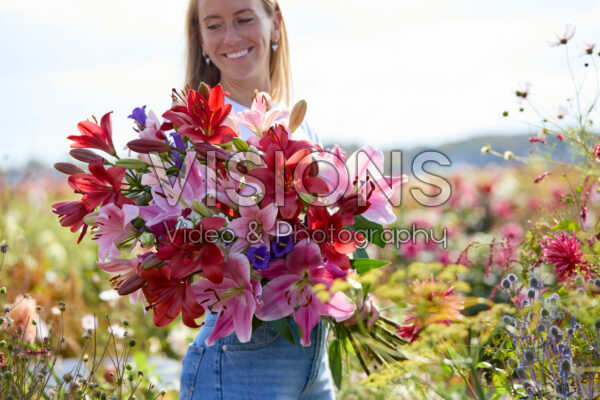 Lady with mixed summer flowers Lady with mixed summer flowers