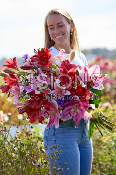 Lady with mixed summer flowers Lady with mixed summer flowers