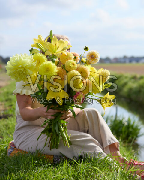 Lady with mixed summer flowers Lady with mixed summer flowers