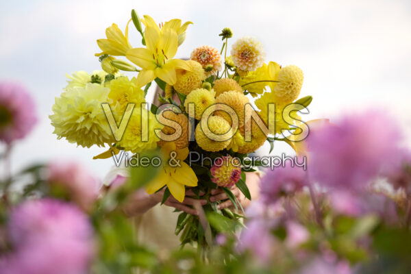 Lady with mixed summer flowers Lady with mixed summer flowers