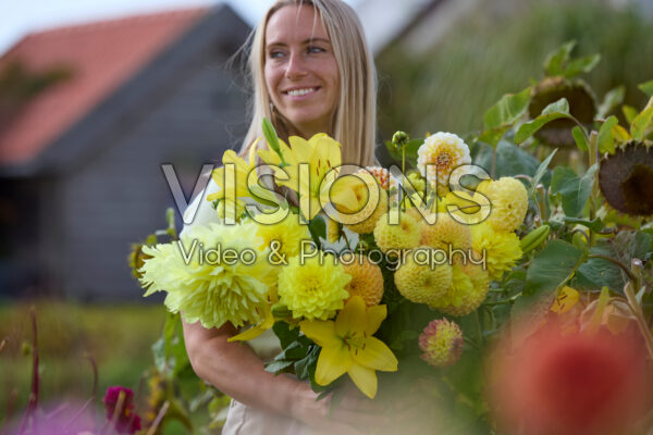 Lady with mixed summer flowers Lady with mixed summer flowers