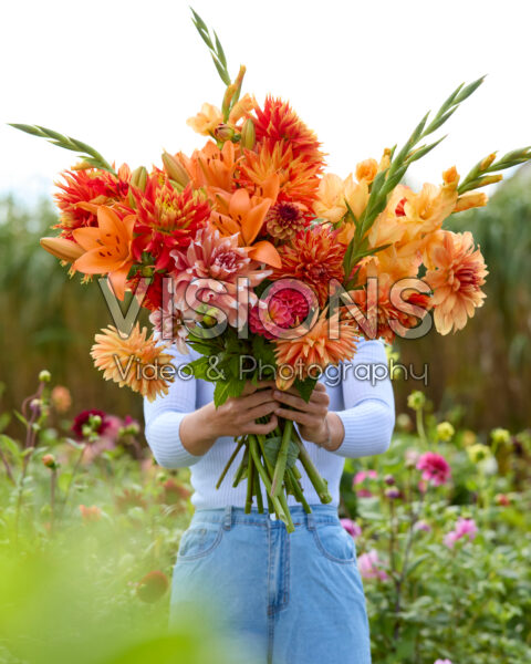 Lady with mixed summer flowers