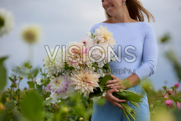 Lady with mixed summer flowers Lady with mixed summer flowers