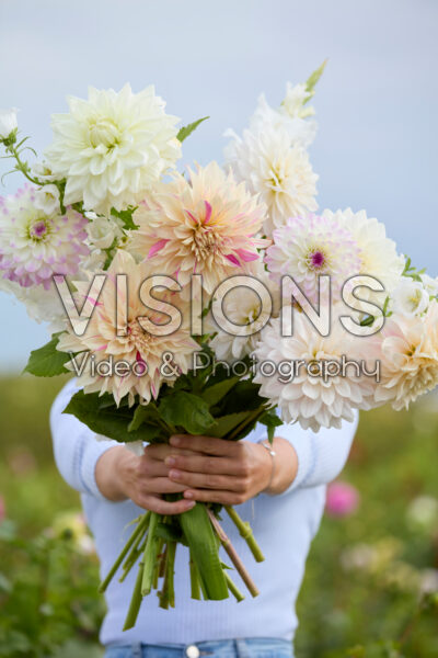 Lady with mixed summer flowers