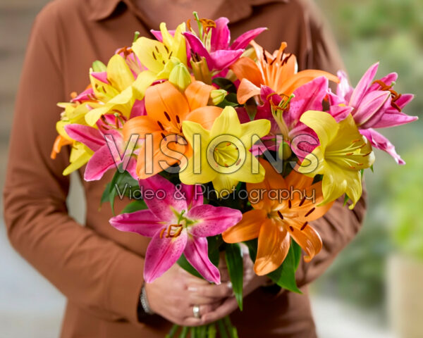 Lady with mixed lily bouquet