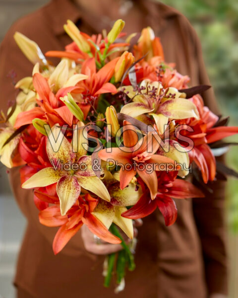 Lady with mixed lily bouquet