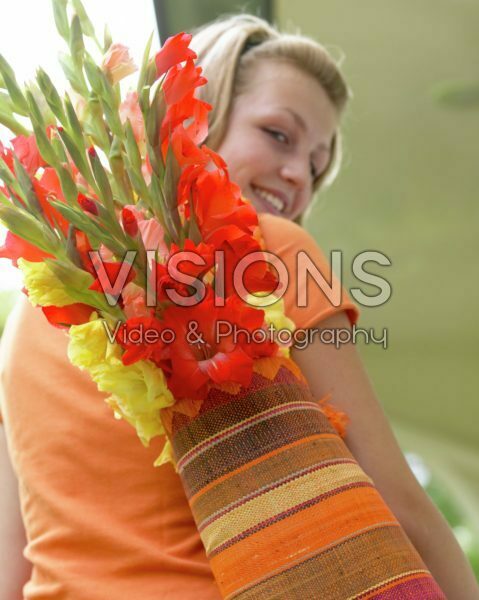 Woman with Gladiolus in bag