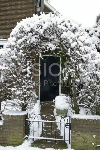 Garden entrance covered with snow