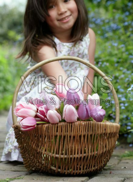 Girl holding tulips