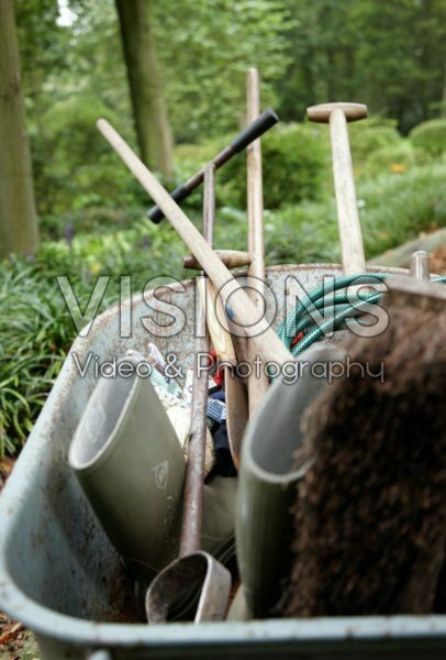 Wheelbarrow with gardening tools