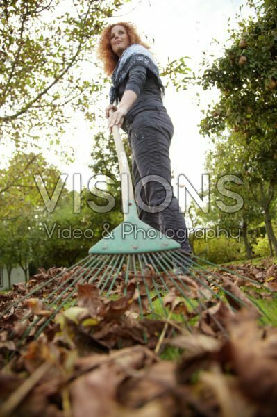Woman raking leaves
