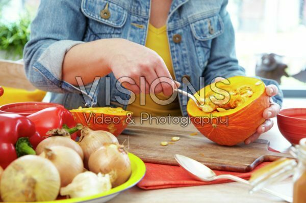 Hollowing out pumpkin for making soup