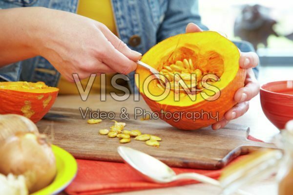 Hollowing out pumpkin for making soup