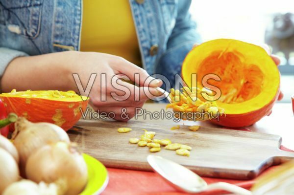 Hollowing out pumpkin for making soup