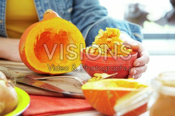 Hollowing out pumpkin for making soup