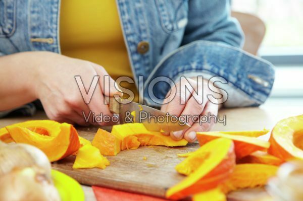 Cutting pumpkin for making soup