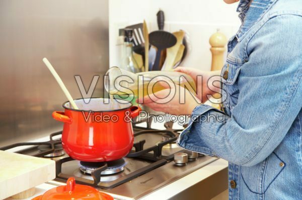 Pouring broth in cooking pan