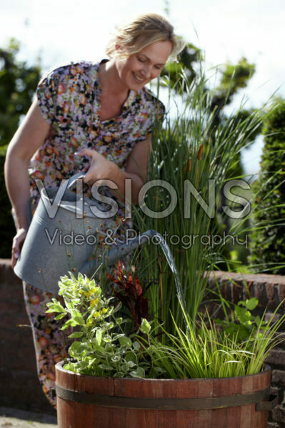 Woman watering plants